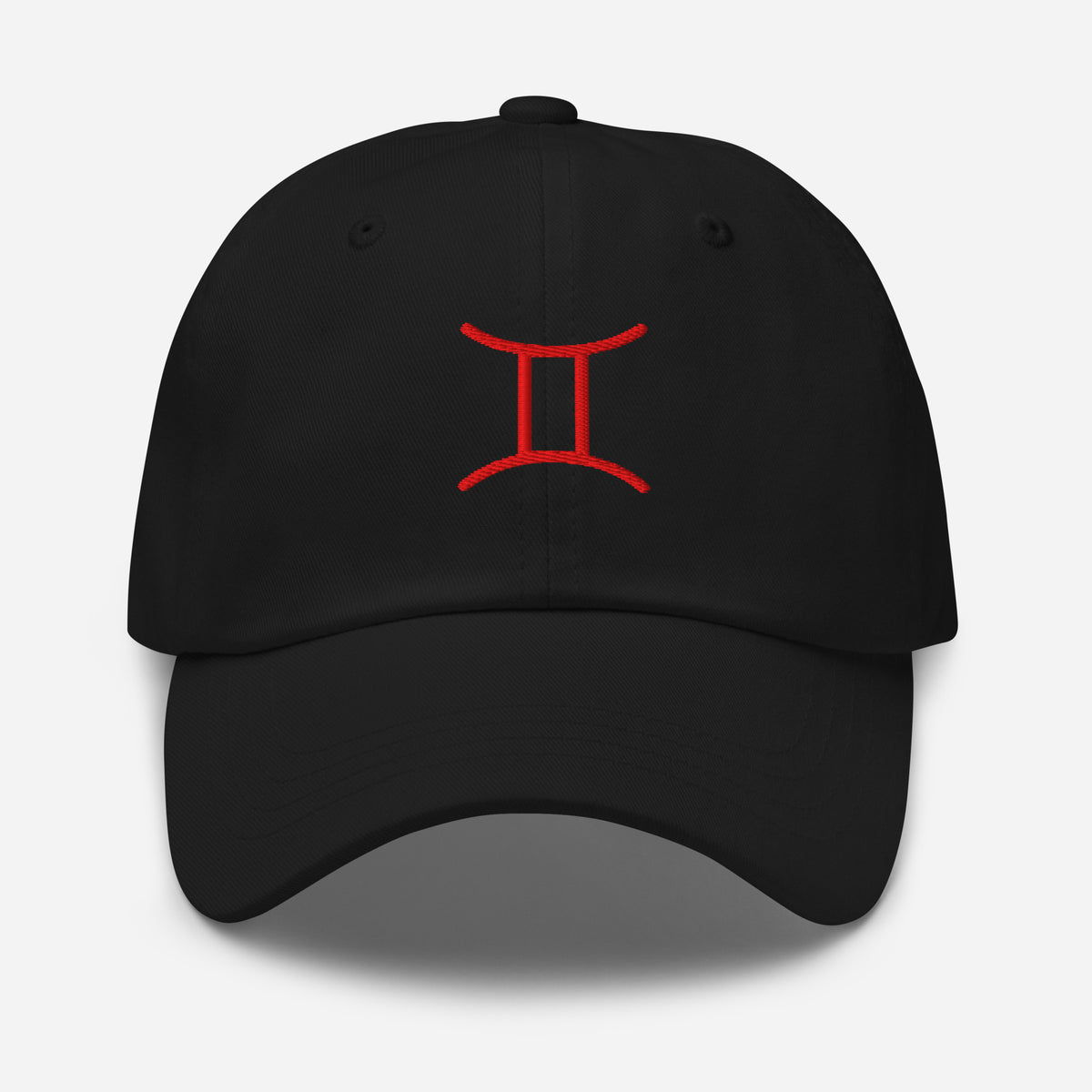 Black Gemini zodiac cap with red embroidered glyph, front view